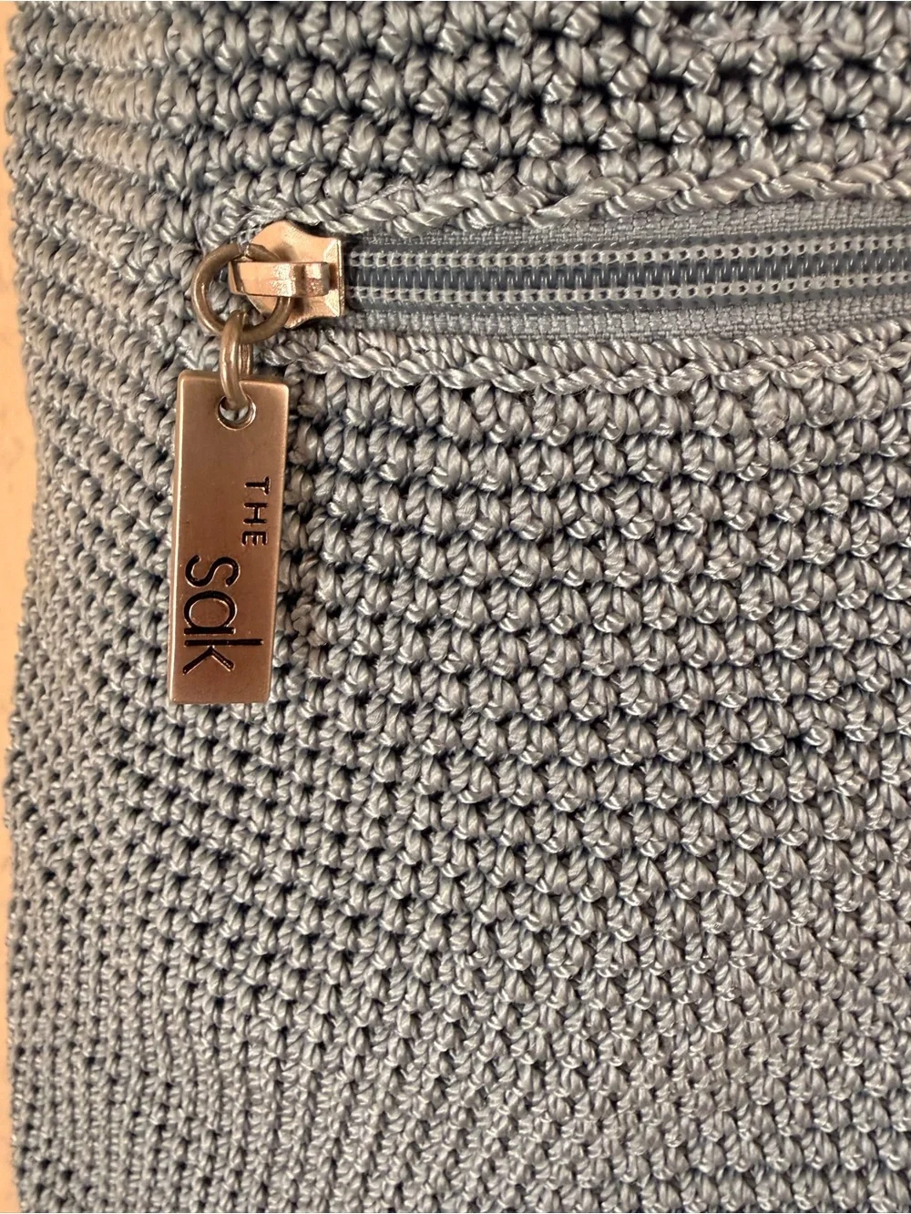 The Sak Light Gray Crochet Crossbody with Logo Charm